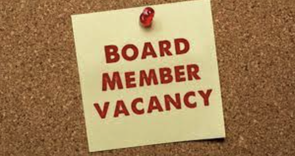 Image of a corkboard with a note attached with the words Board Member Vacancy
