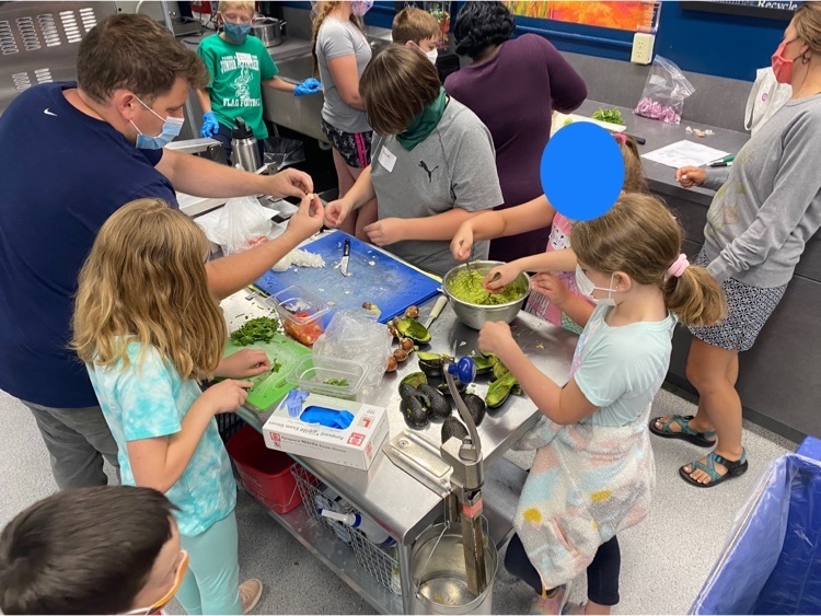 children are making homemade guacamole and salsa